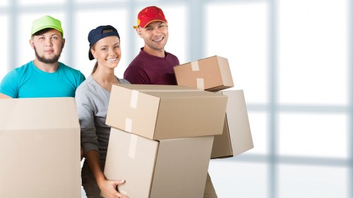 Trained storage staff using PPE while handling items