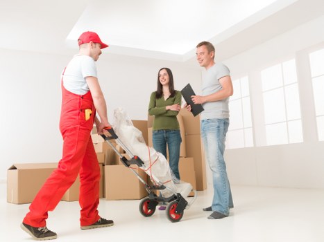 Careful packing of fragile belongings for a move in Customhouse