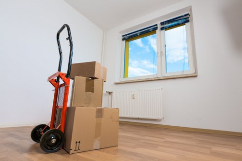 Furniture and boxes being unloaded during local removals in Customhouse